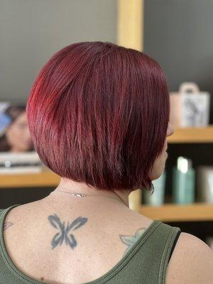 Ruby red color and a sharp precision haircut.