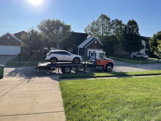 Fuel leak caused at the dealer, being towed back drove home with a potential fire hazard.