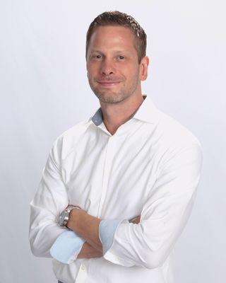 Dr. Matt Davis proud owner of Chiropractic of Naples