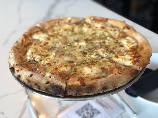 The "Zeus Pie" (Ricotta, Parmesan, Shredded Mozzarella, Red Onion, Pistachios, Oregano and Hot Honey)