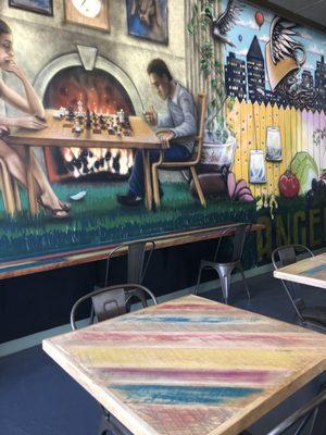 Colorful interior artwork and tables