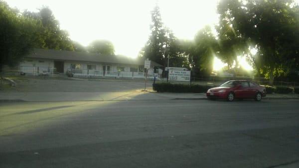 Front of church and parking lot early in the morning