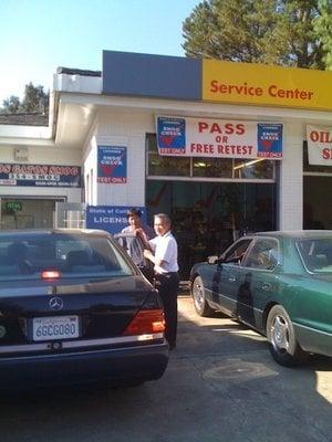 Loi helping a customer with her stuck window.