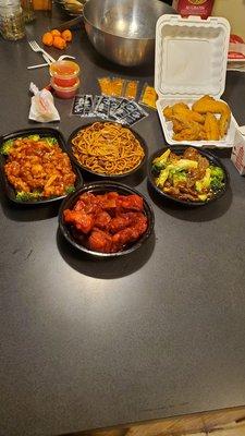 Broccoli beef, beef lo mein, orange chicken, spring rolls and rib tips