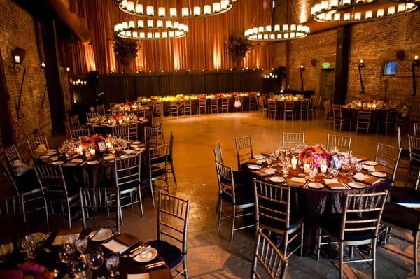 Reception table arrangements - Mandy got swatches of our linens and worked flowers/candles in to complement them.