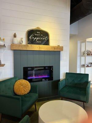 Cutest little vignette chair setting with a faux fireplace