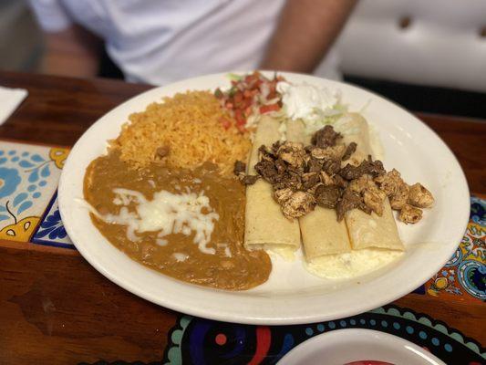 Enchiladas Al carbon. They bring the queso on the side to drizzle over the top.