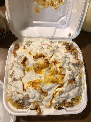 Chicken over rice with extra white sauce please