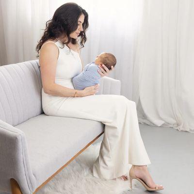 In studio newborn session with full hair, makeup and wardrobe for mom and baby.  10 days old.