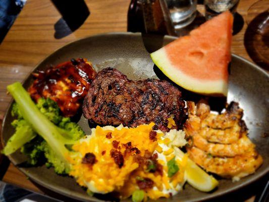 Loaded potatoes, fruit, broccoli, shrimp , steak and chicken