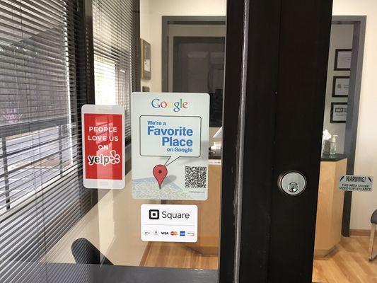 Data Savers LLC front door stickers - People Love Us on Yelp! & "We're a favorite place on Google"