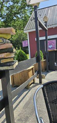 The books on the patio and the name of the business.