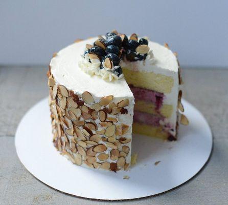 Orange Blueberry Cake: orange chiffon cake with blueberry whipped cream filling and vanilla buttercream and/or cream cheese frosting