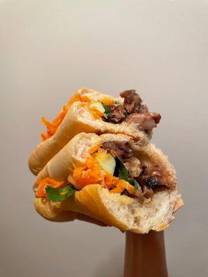 $11.43 Grilled Chicken Banh Mi. Delicious! Dark meat, marinated well. Mild spice