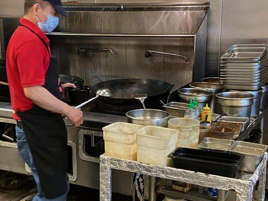 Owner making my Hot & Sour Soup while I wait!