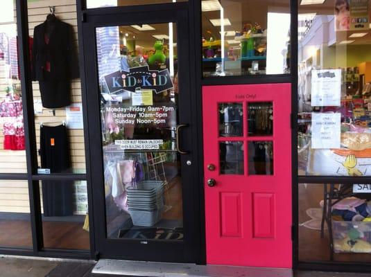 The kids have their own entrance to the store...the pink door is labeled 'Kids Only'