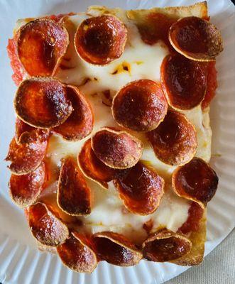 Pepperoni, and I mean the real deal with flavor and look at the cheese. Ordered this slice with extra pepperoni too! FORGET ABOUT IT!!!