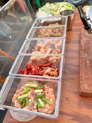 Variety of raw meat ready to be grilled