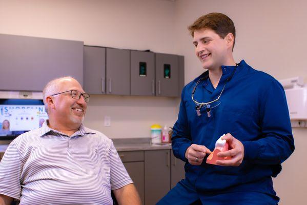 Dr. Rolotti talking to a patient about their treatment solutions