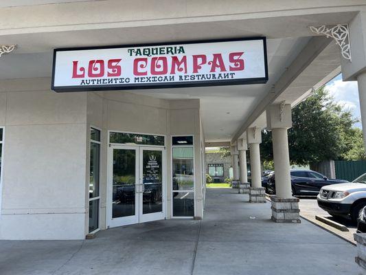 the entrance of this restaurant and sign  showing the location of the restaurant