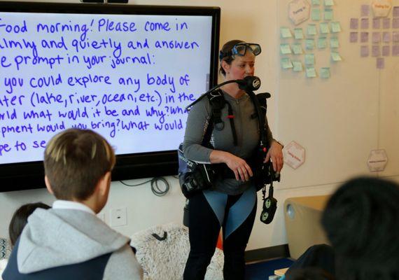 Ms. Sanders demonstrating how to use the BCD on a tank that was kindly loaned to us by Underwater Safaris!