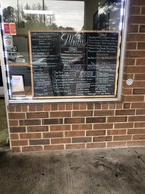 Menu in the window . You order outside and wait .