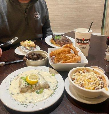 Sea bass, squash casserole, onion rings, ribeye, twice baked potato and mushrooms