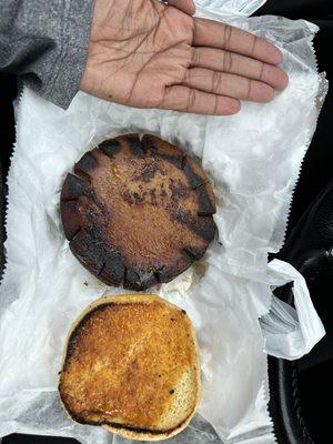 Fried bologna sandwich with my hand next to it to show the size of the sandwich