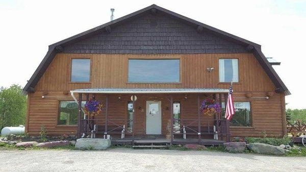 Main entrance of lodge with Summer colors in bloom.