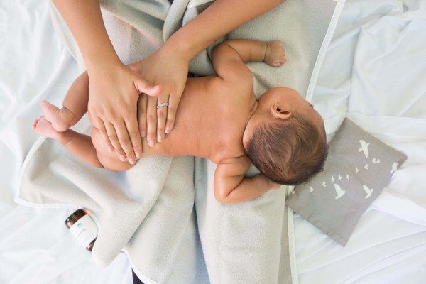 A simple back massage calms baby's central nervous system.