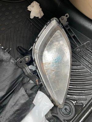 A headlight that had fallen off the car