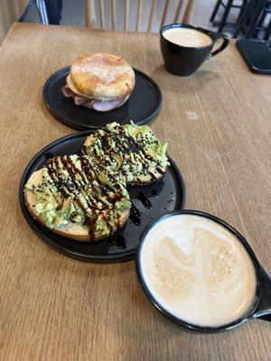 Latte, avocado toast and breakfast sandwich