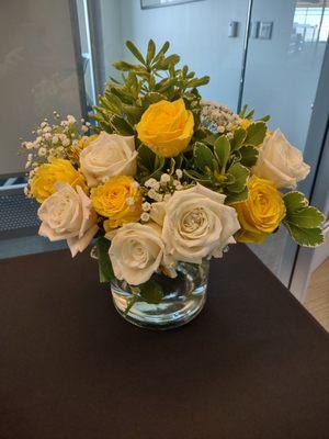 Bouquet 2: Arranged (by me) in glass containers for our office event.