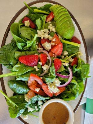 Strawberry Avocado Spinach Salad with tomatoes, red onion, blue cheese, candied walnuts and balsamic dressing. Very tasty too.