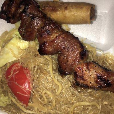 Pork bbq with pancit canton (rice noodle mixed with some chow mien noodles) & Lumpia (spring roll)