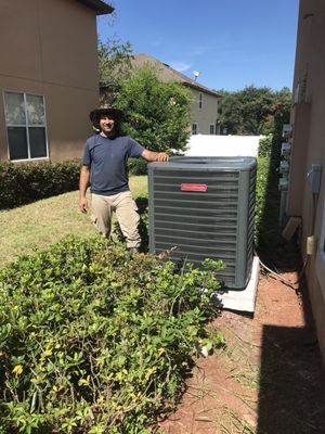 Out door heat pump with the master standing next to it