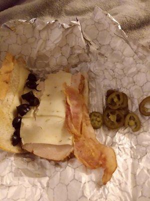 Line of olives, raw bacon, not the same turkey and jalapenos instead of banana rings