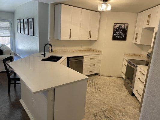 Before picture of kitchen before floors and backsplash added