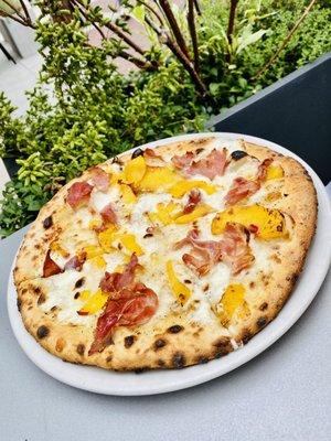 Peach and prosciutto seasonal pizza