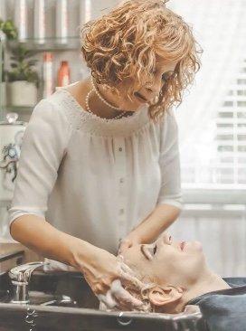 Welcome! Yes, that's me giving my clients the best shampoo massage. It's so relaxing everyone doesn't want me to stop shampooing their hair