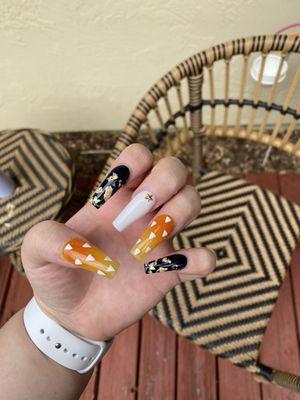 Zenitsu inspired nails with little butterflies to represent Shinobu Kocho