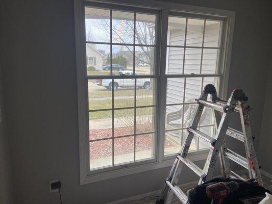 Home with freshly painted interior. Home owner wanted help putting up her new curtains. They definitely made a difference