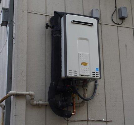 Outdoor tankless water heater is a space saver.