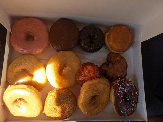 Dozen : strawberry frosted, chocolate, Boston cream, lemon, glazed, raspberry & apple fritters, cinnamon sugar, maple, chocolate frosted