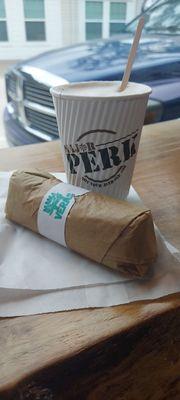 Turkey sausage, egg, feta cheese in a spinach wrap breakfast burrito. Caramel, vanilla latte with oat milk.