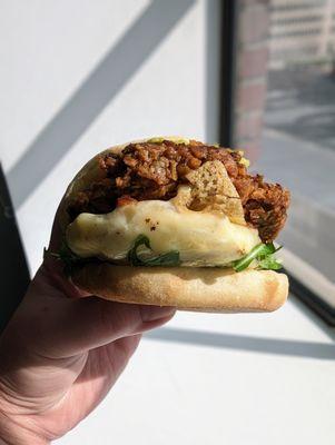 The Iggycado with  Swiss, arugula, and a veggie sausage patty on a large English muffin.