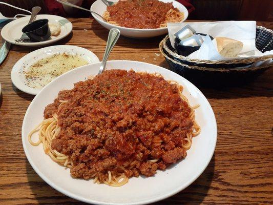 Pasquale's spaghetti dinner with meat sauce ft the dinner bread we couldn't keep our hands off of.