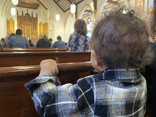 My son enjoying church with us