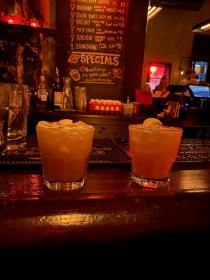 2 whiskey sours at the bar