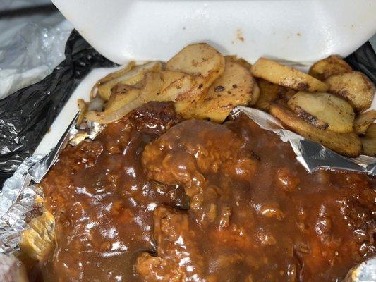 Smothered pork chops and potatoes food always fresh and good seasoned just right